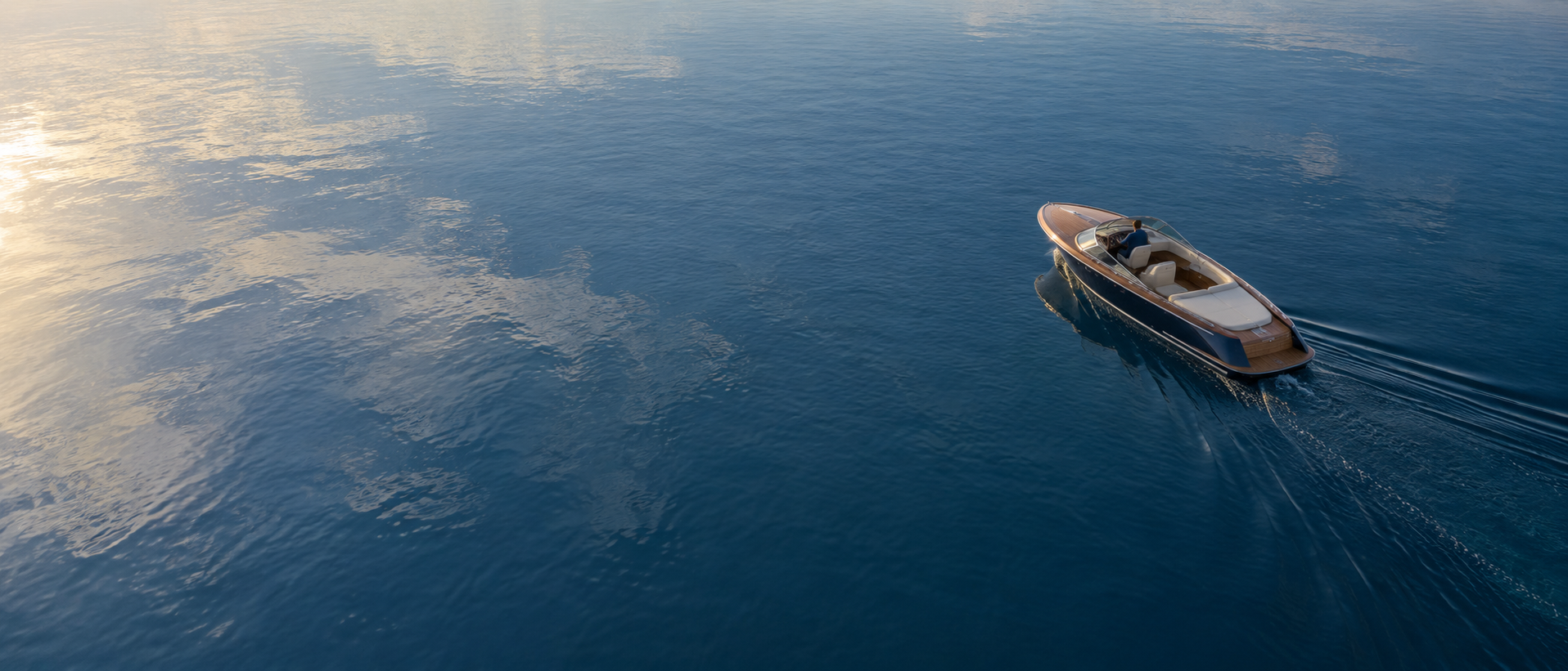 Aerial concept view of a small boat on open water.